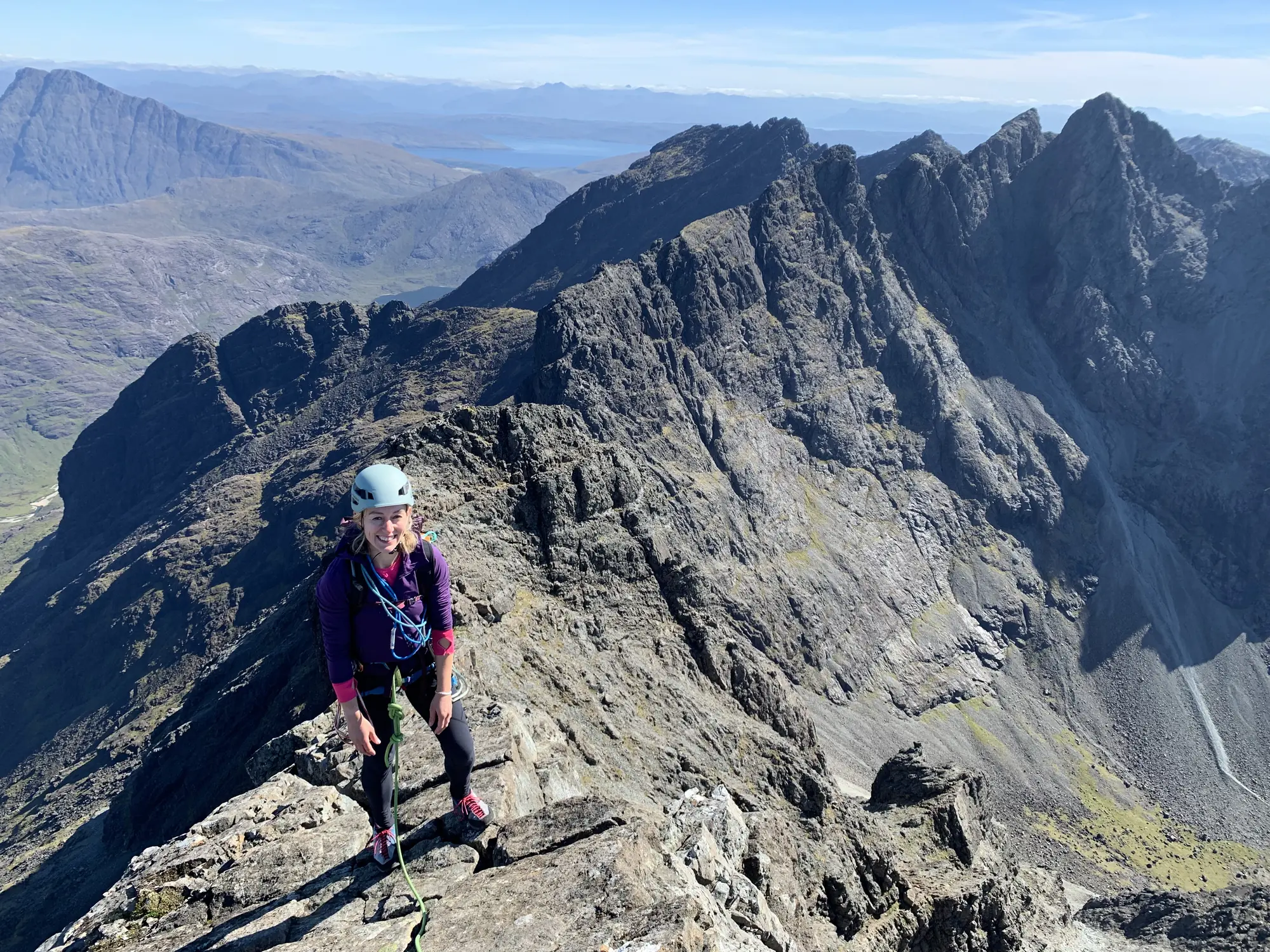 Climber traversing a mountain ridge