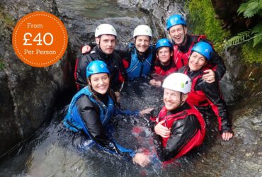 A group enjoying Ghyll Scrambling in the Lake District